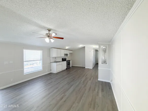 a kitchen with a sink cabinets stainless steel appliances and a window