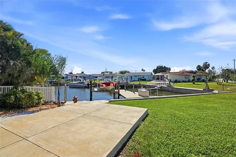 a front view of the house with yard and green space