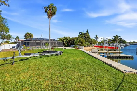 a view of small pool with seating area