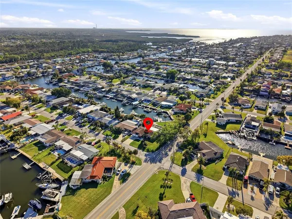 an aerial view of a house with a swimming pool