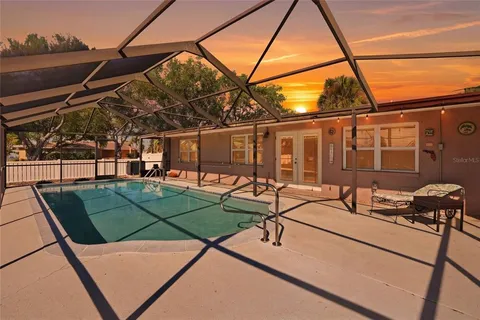 a view of a backyard with sitting area