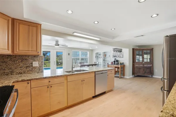 a kitchen with sink and cabinets