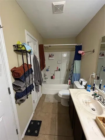 a bed room with a bed and a large mirror