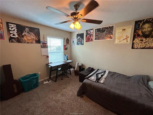 a kitchen with stainless steel appliances granite countertop a refrigerator a sink and a stove