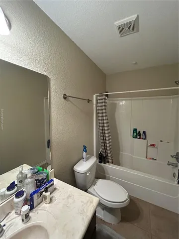 a room with furniture and air hockey table