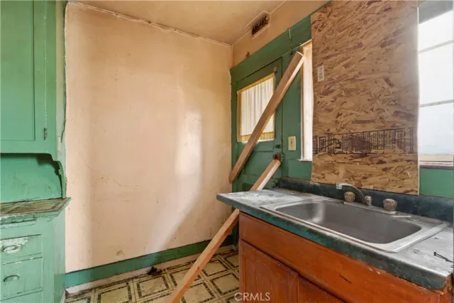 a kitchen with a sink and a window