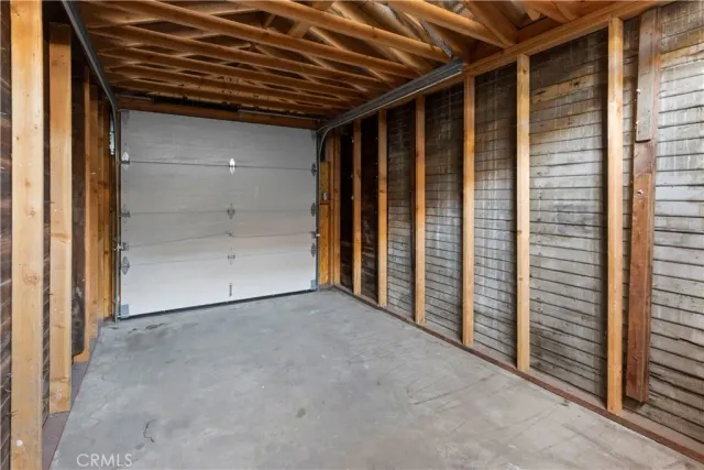 a view of staircase with railing and a chandelier
