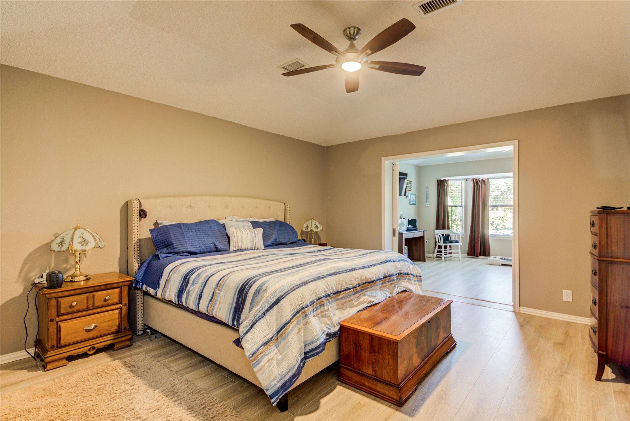 200 Harbor Circle Georgetown, TX 78633 - Photo 12 of 38 a bedroom with a bed and a chandelier