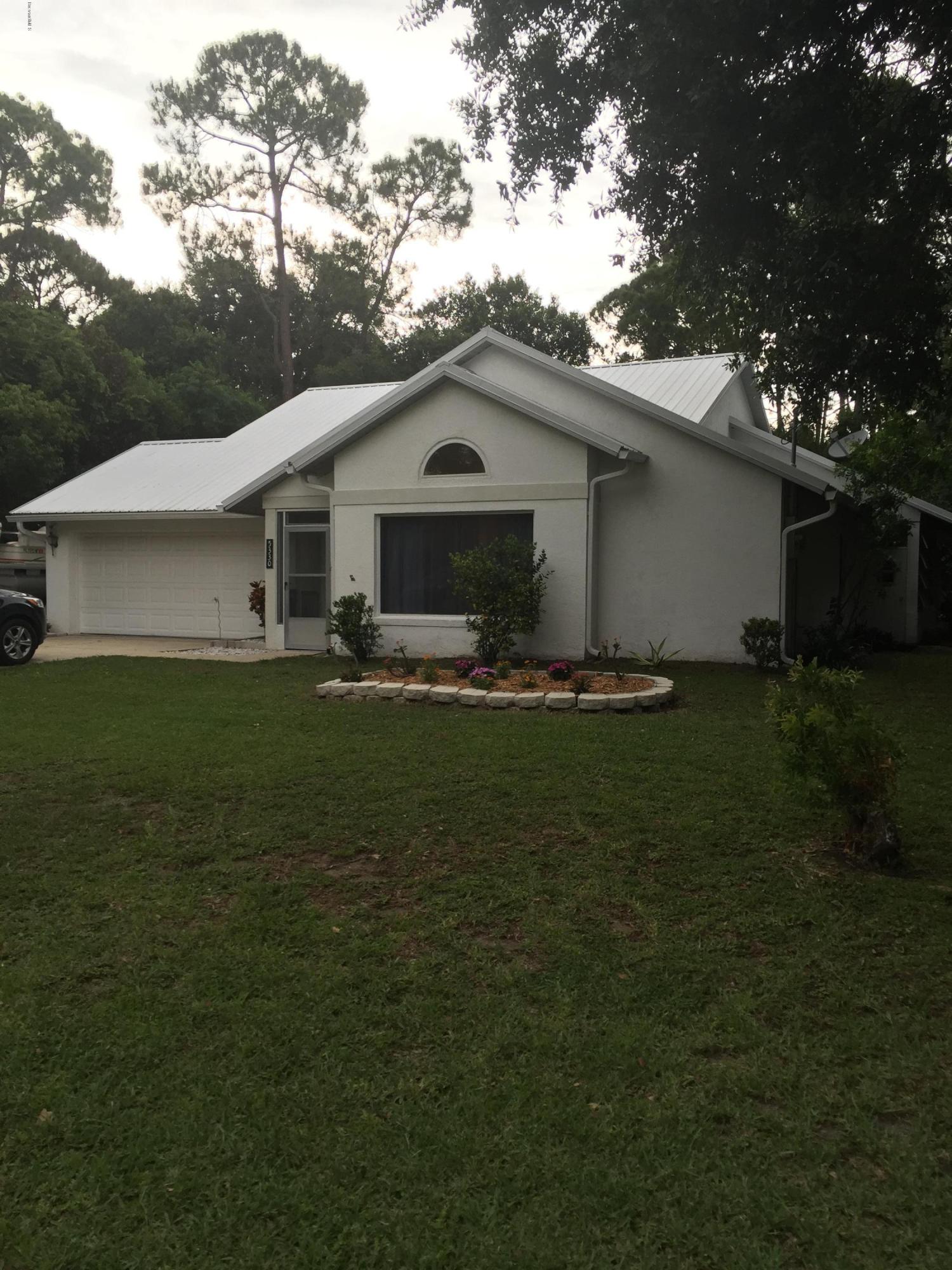 5330 Holden Road Cocoa, FL 32927 - Photo 2 of 23 a front view of house with yard and green space