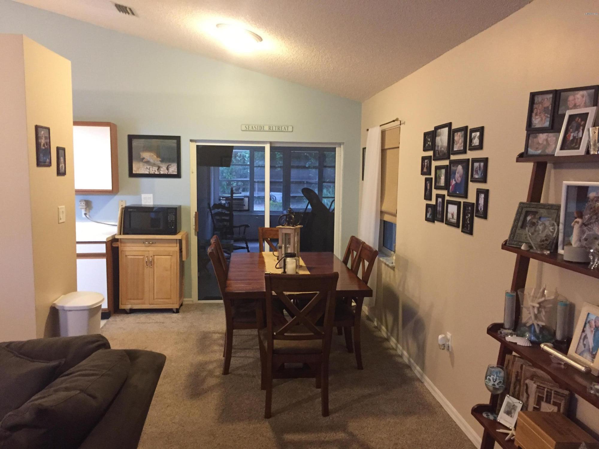 5330 Holden Road Cocoa, FL 32927 - Photo 11 of 23 a living room with furniture and a flat screen tv