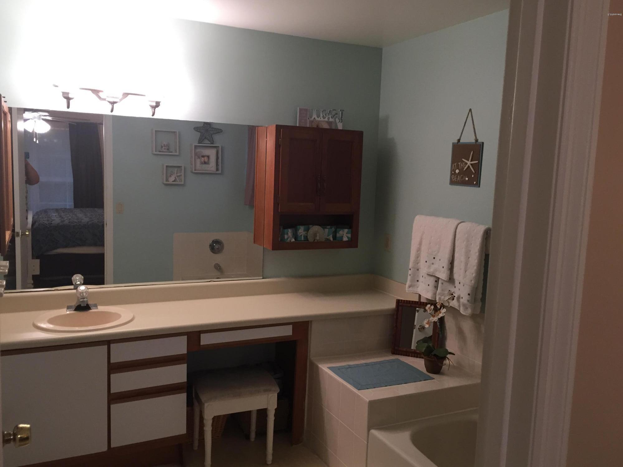 5330 Holden Road Cocoa, FL 32927 - Photo 17 of 23 a bathroom with a sink and a mirror