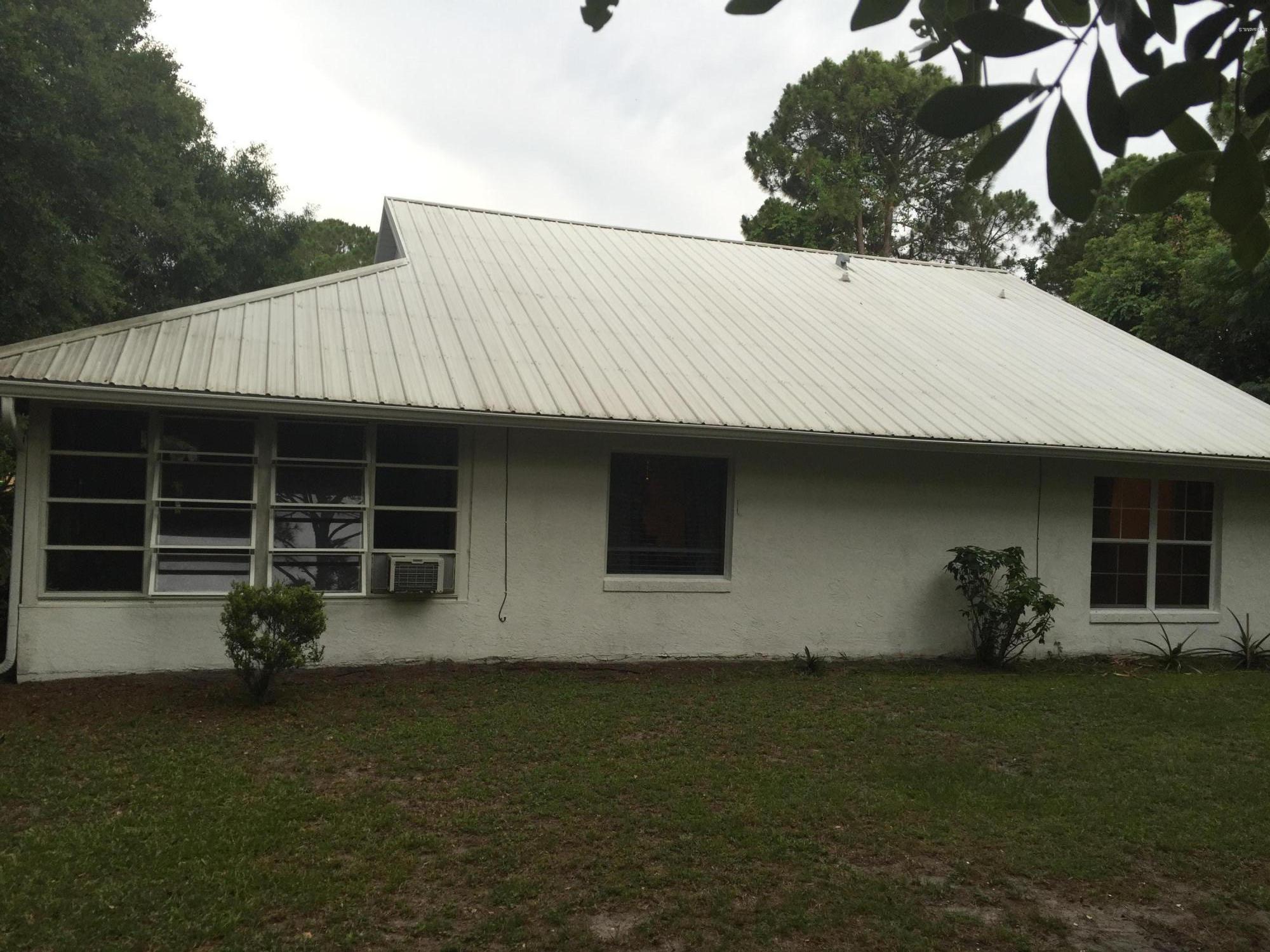 5330 Holden Road Cocoa, FL 32927 - Photo 3 of 23 a backyard of a house with table and chairs