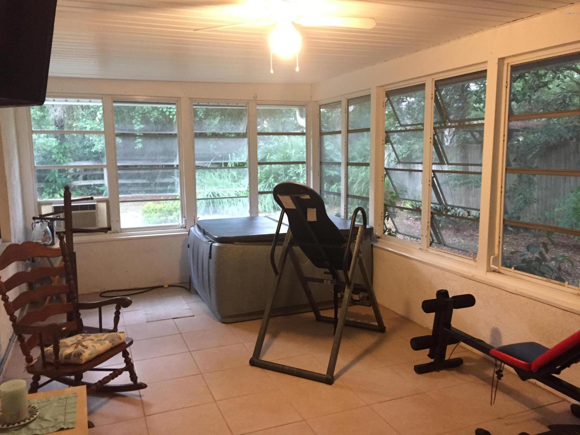 5330 Holden Road Cocoa, FL 32927 - Photo 22 of 23 a living room with furniture and a window