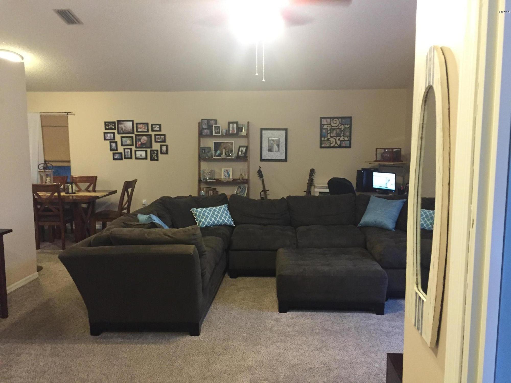 5330 Holden Road Cocoa, FL 32927 - Photo 5 of 23 a living room with furniture and a window