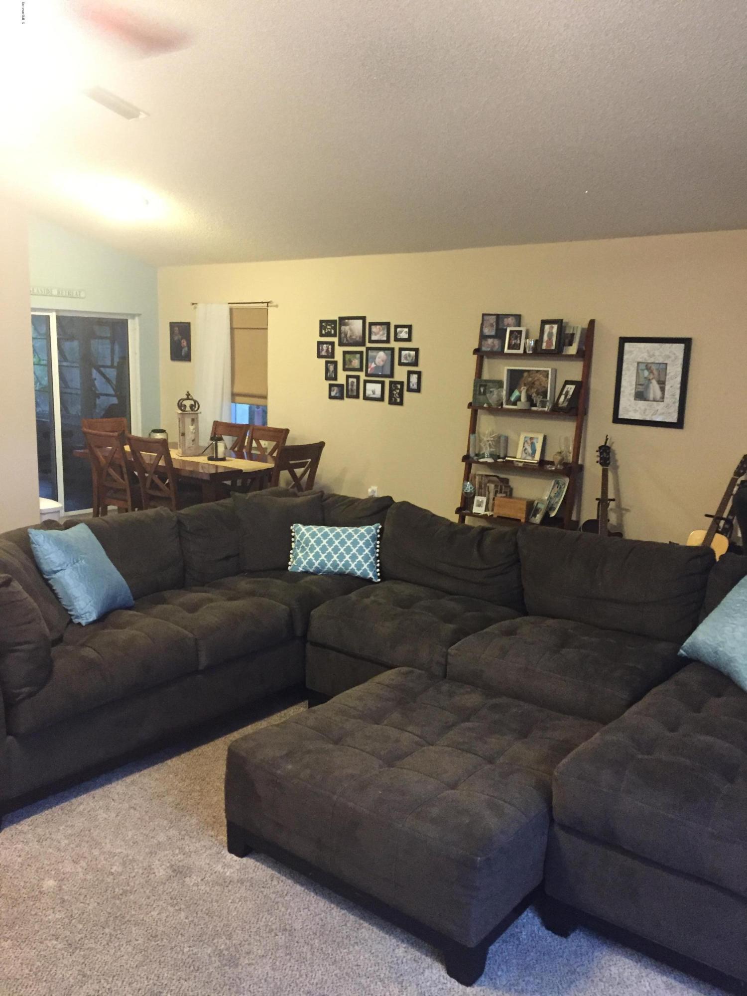 5330 Holden Road Cocoa, FL 32927 - Photo 6 of 23 a living room with furniture and a couch