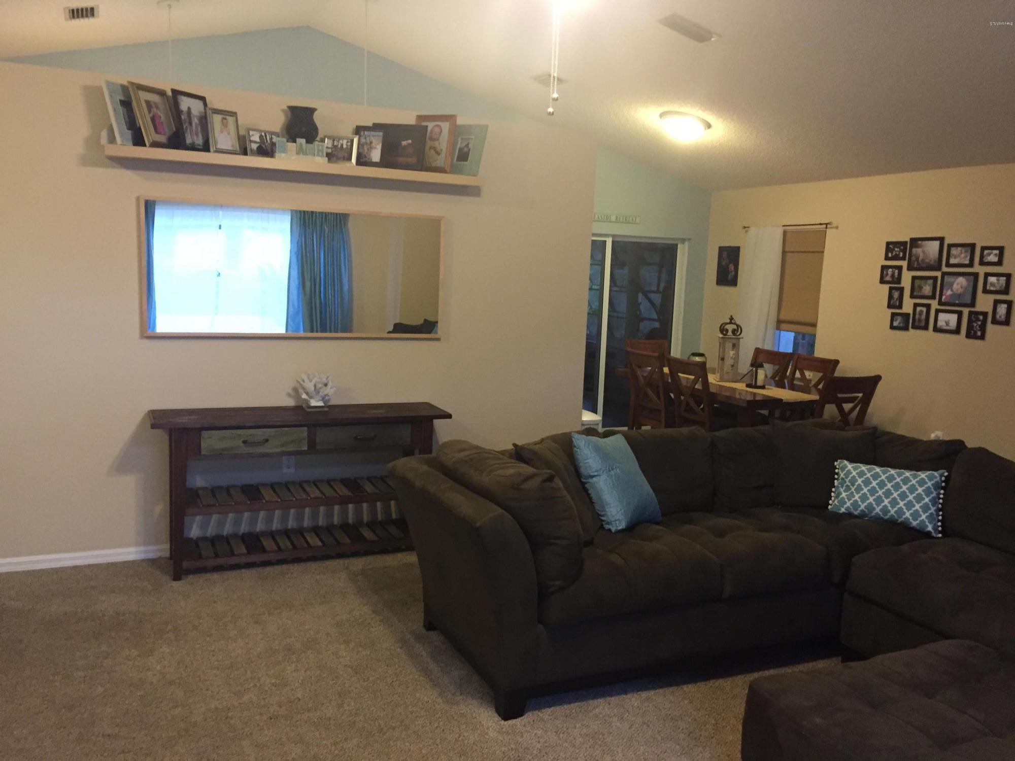 5330 Holden Road Cocoa, FL 32927 - Photo 7 of 23 a living room with furniture and painting on the wall