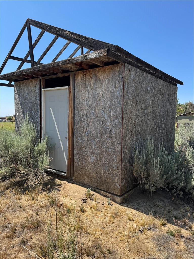 44425 Howard Road Anza, CA 92539 - Photo 13 of 22 a backyard of a house with lots of green space