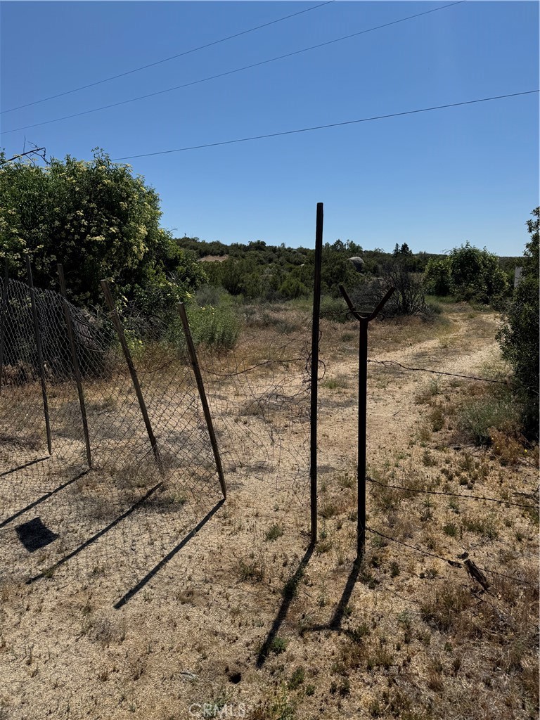 44425 Howard Road Anza, CA 92539 - Photo 2 of 22 a view of a yard with wooden fence