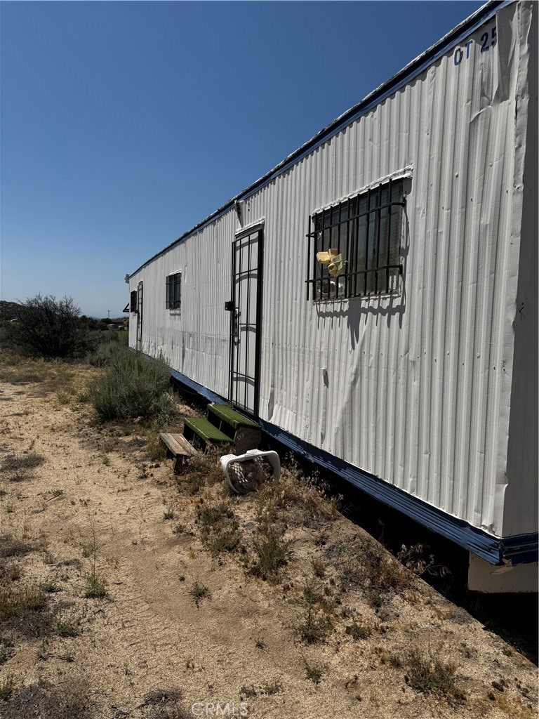 44425 Howard Road Anza, CA 92539 - Photo 5 of 22 a view of a house with backyard and wooden fence