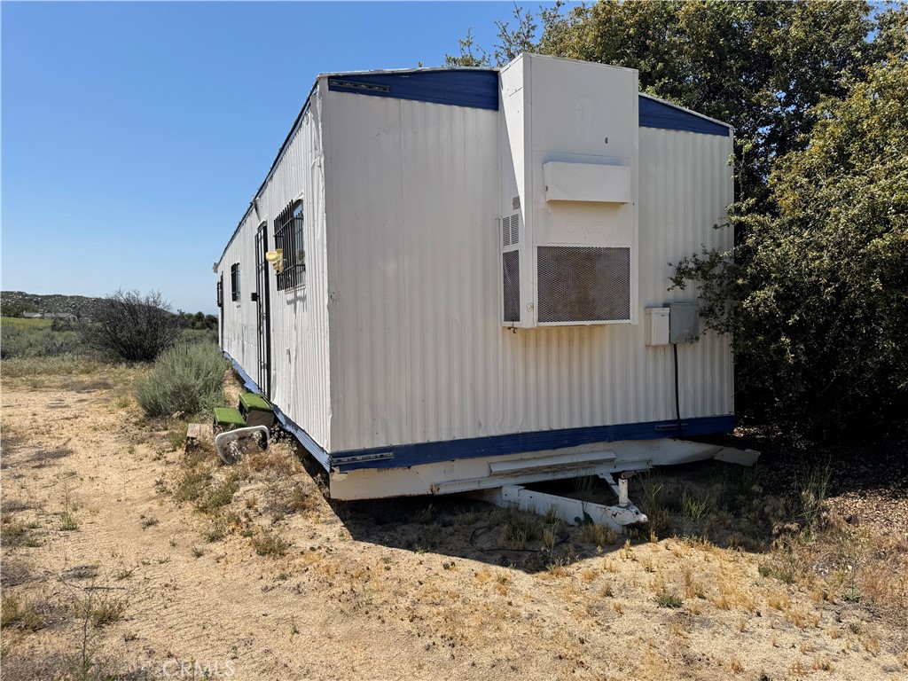 44425 Howard Road Anza, CA 92539 - Photo 6 of 22 a view of a house with a yard covered in snow