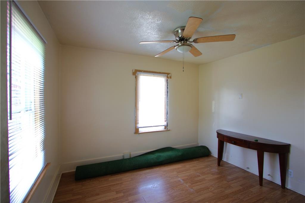 233 Allen Avenue Donora, PA 15033 - Photo 11 of 31 Nice 11x10 Bedroom in Alley House w/ Engineered Flooring, Ceiling Fan Light & 2 Windows calling in the Natural Light!