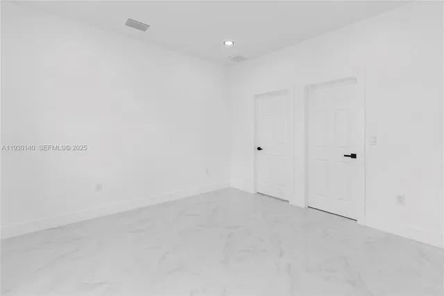 a bathroom with a toilet and a tub