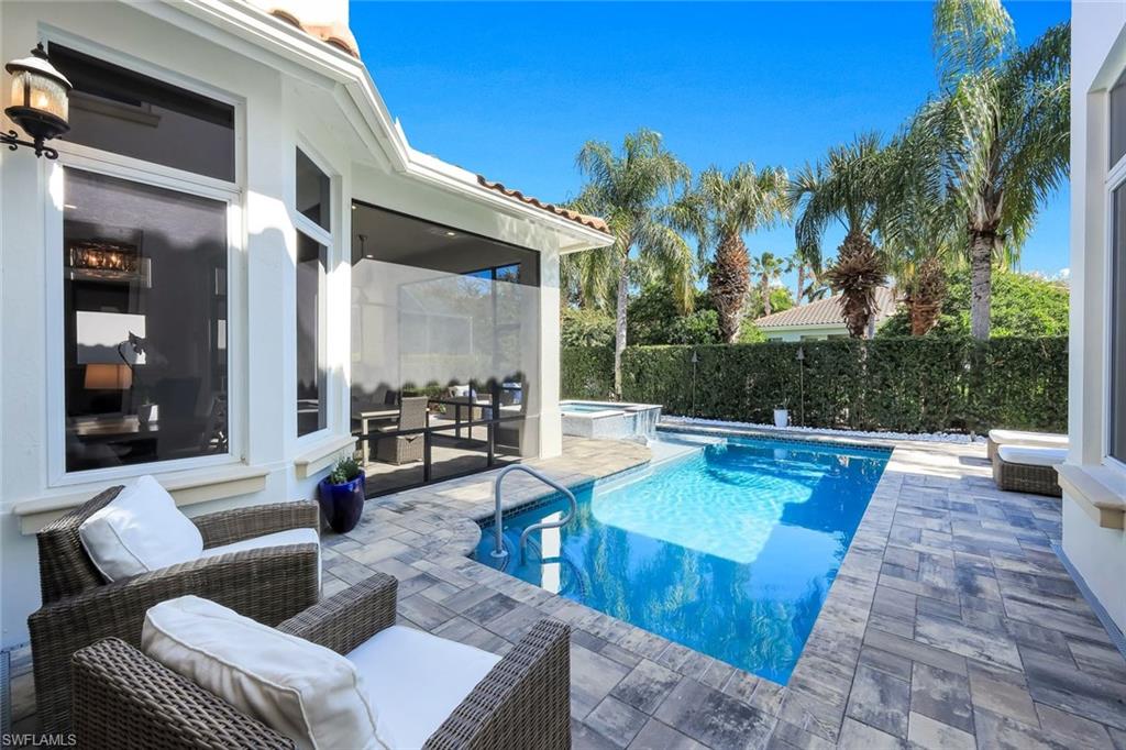 2106 Modena Court Naples, FL 34105 - Photo 40 of 42 a view of a patio with couches table and chairs