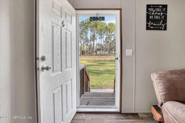 a living room with furniture and a window