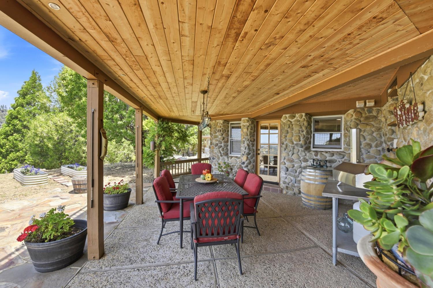 7201 Happy Valley Road Somerset, CA 95684 - Photo 37 of 75 The back patio has an incredible a knotty pine shiplap ceiling. This would make for the perfect outdoor kitchen California room. So much charm and character.