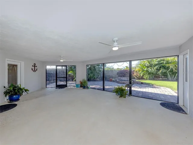 a kitchen with granite countertop a white stove top oven and cabinets with wooden floor
