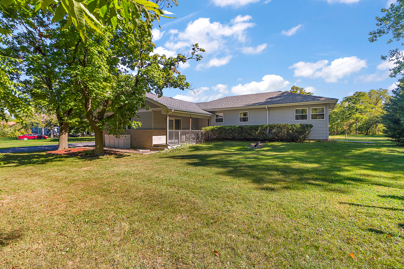a front view of house with yard and green space