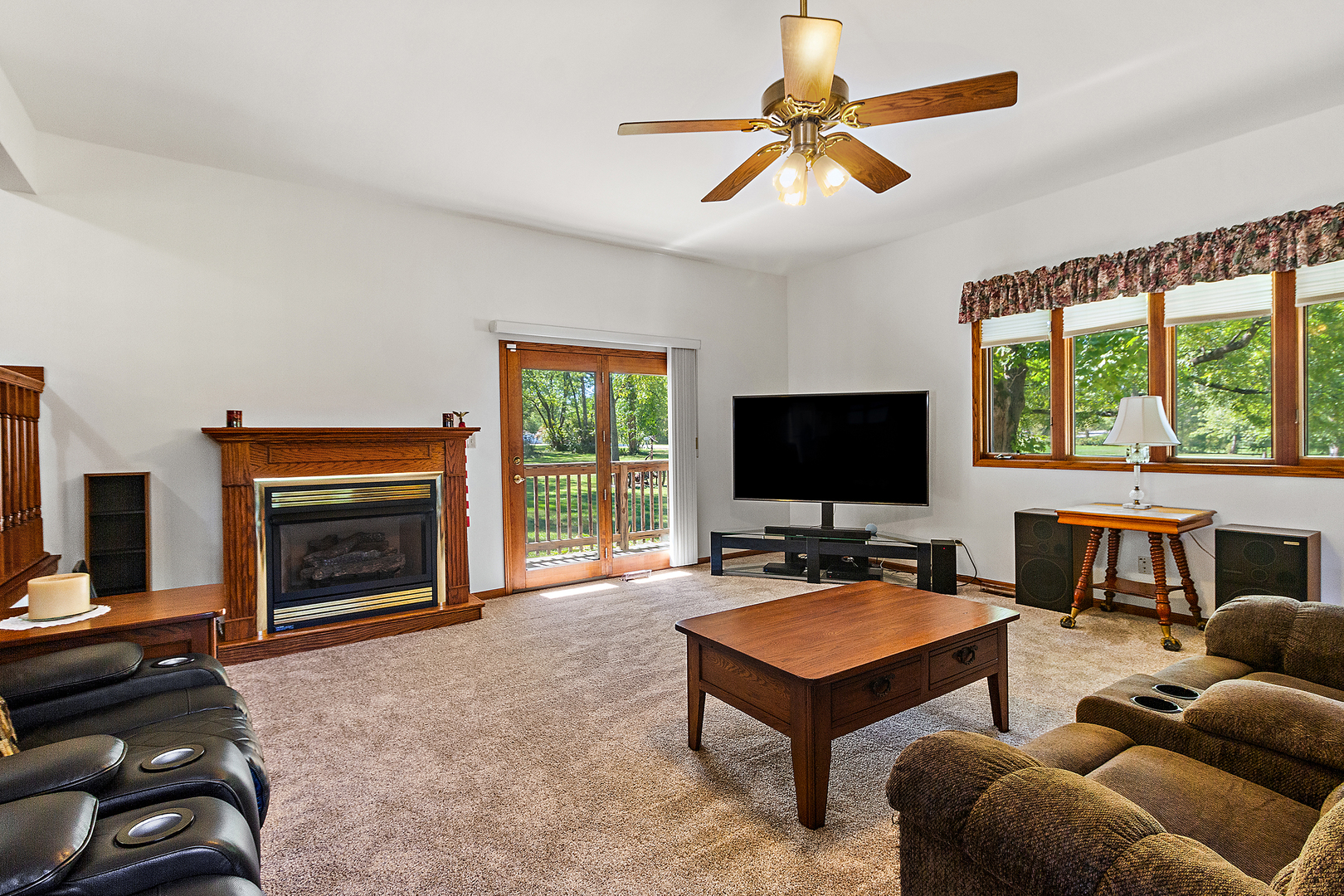 23765 South Loomis Street Crete, IL 60417 - Photo 11 of 23 a living room with furniture a flat screen tv and a fireplace