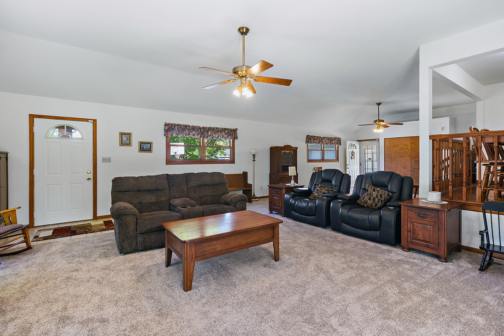 23765 South Loomis Street Crete, IL 60417 - Photo 12 of 23 a living room with furniture a ceiling fan and a window