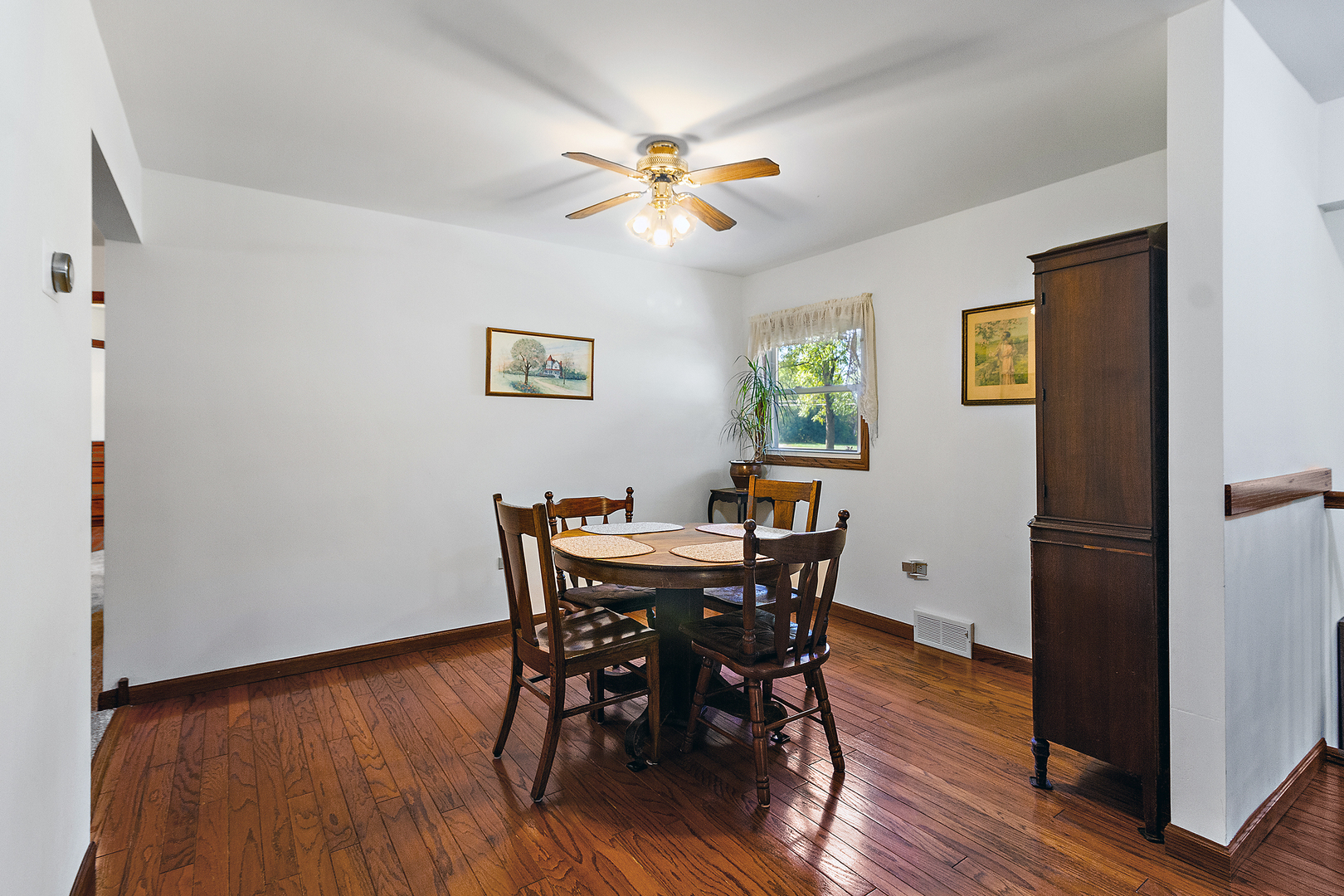 23765 South Loomis Street Crete, IL 60417 - Photo 16 of 23 a view of a dining room with furniture and wooden floor