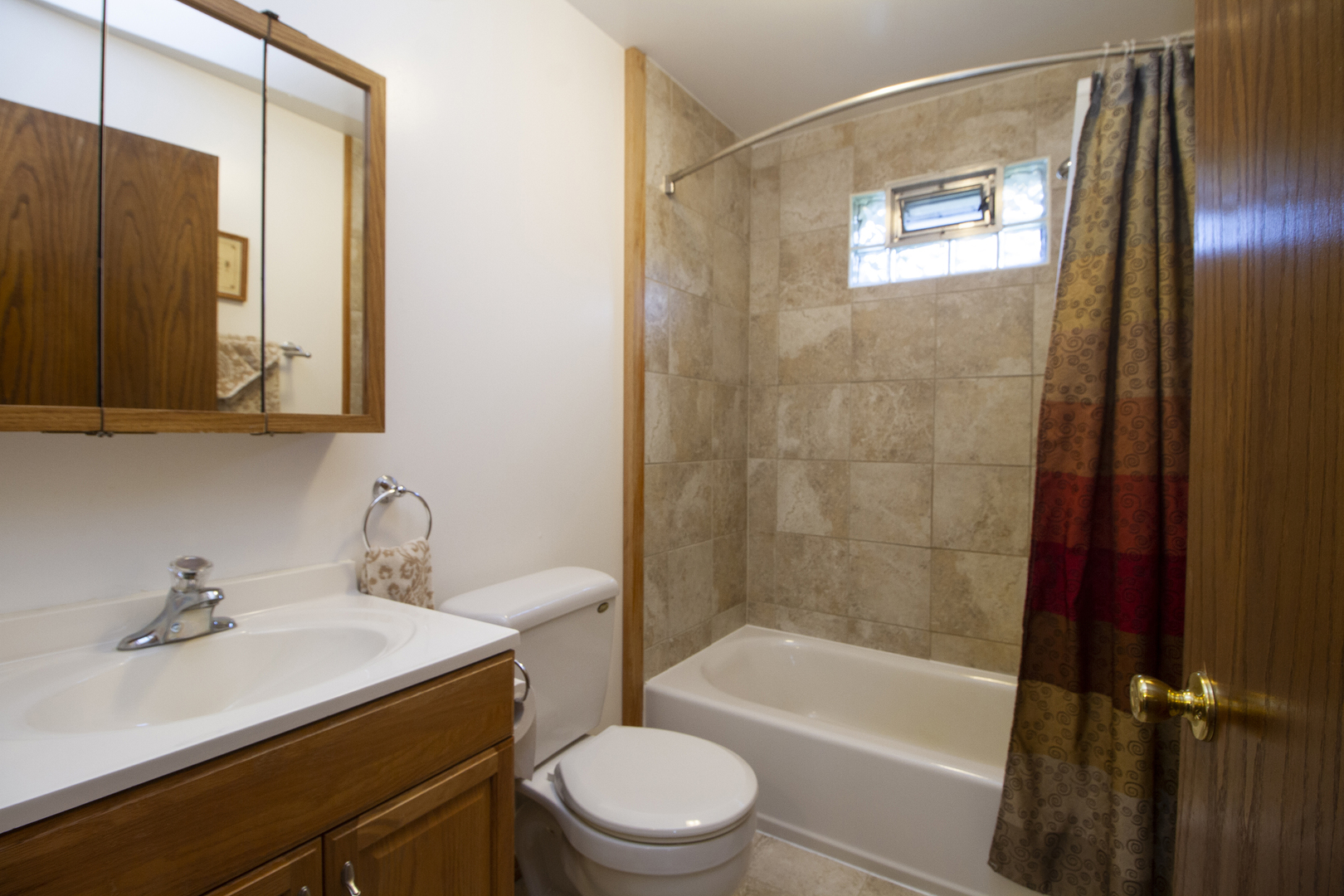 23765 South Loomis Street Crete, IL 60417 - Photo 23 of 23 a bathroom with a sink a toilet and shower