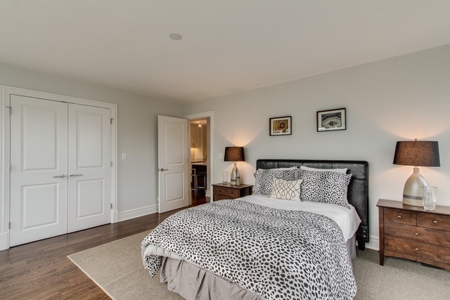 247 East Chestnut Street, Unit 2503 Chicago, IL 60611 - Photo 13 of 24 a bedroom with a bed and wooden floor
