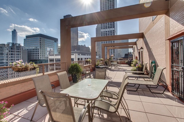 247 East Chestnut Street, Unit 2503 Chicago, IL 60611 - Photo 21 of 24 a view of a dining room with furniture