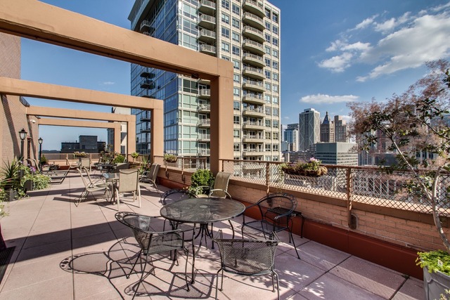 247 East Chestnut Street, Unit 2503 Chicago, IL 60611 - Photo 23 of 24 a outdoor space with lots of tables and chairs