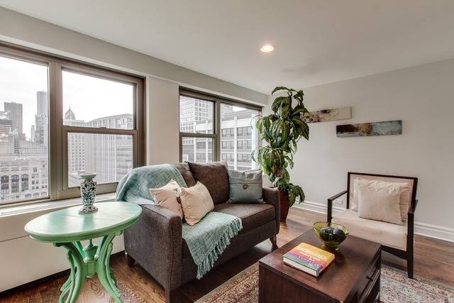247 East Chestnut Street, Unit 2503 Chicago, IL 60611 - Photo 4 of 24 a living room with furniture and a window