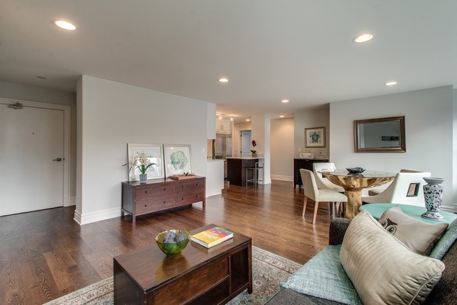 247 East Chestnut Street, Unit 2503 Chicago, IL 60611 - Photo 6 of 24 a living room with furniture and a wooden floor
