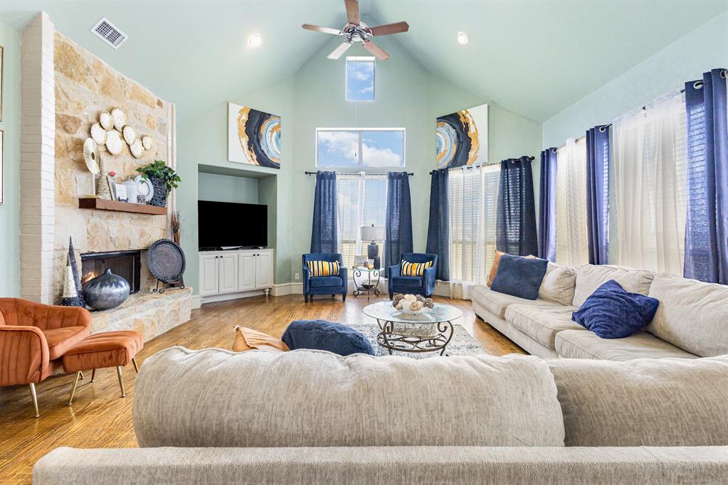 123 Ranch House Road Rockwall, TX 75032 - Photo 11 of 23 a living room with furniture and a flat screen tv