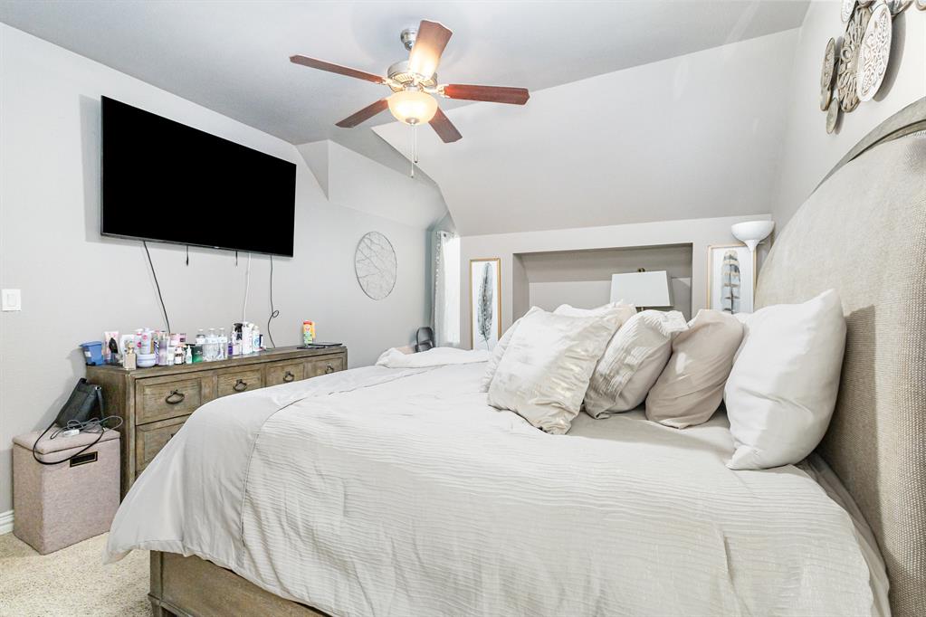 123 Ranch House Road Rockwall, TX 75032 - Photo 15 of 23 a bedroom with a bed and a flat screen tv