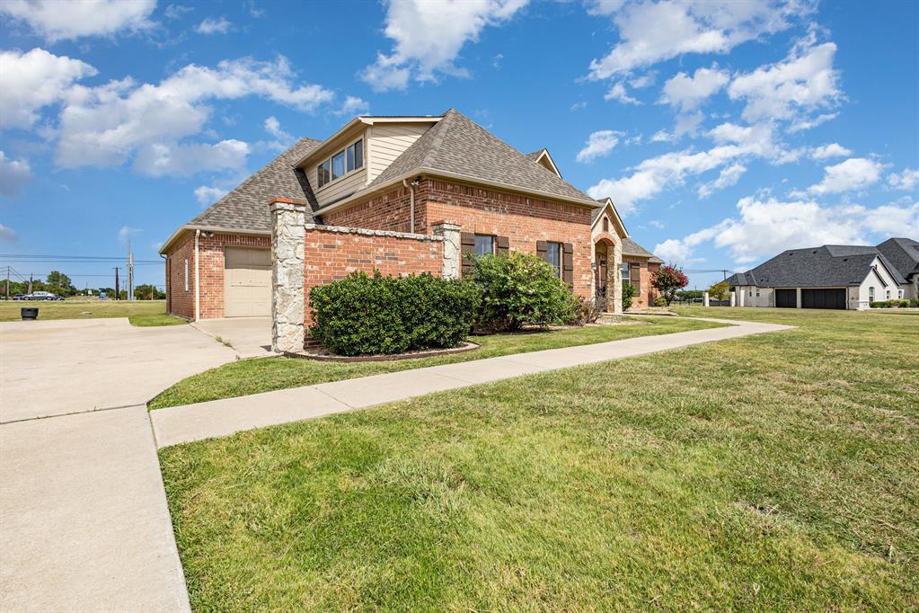 123 Ranch House Road Rockwall, TX 75032 - Photo 20 of 23 a front view of a house with a yard