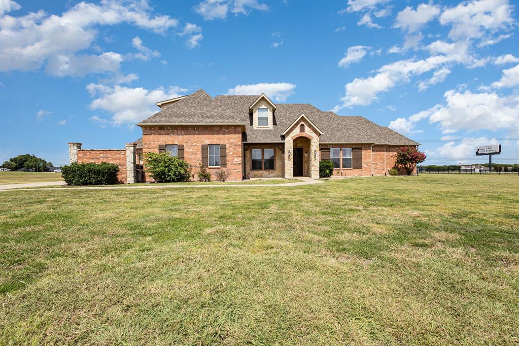 123 Ranch House Road Rockwall, TX 75032 - Photo 21 of 23 a front view of a house with a garden
