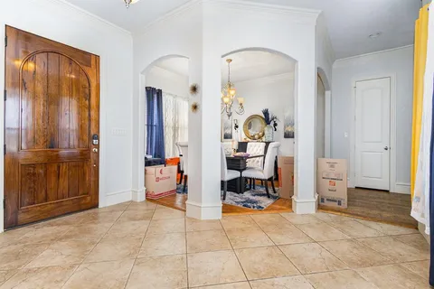 a view of a livingroom with furniture and bedroom view