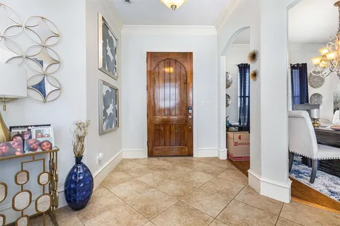 a kitchen with stainless steel appliances granite countertop a refrigerator sink and stove