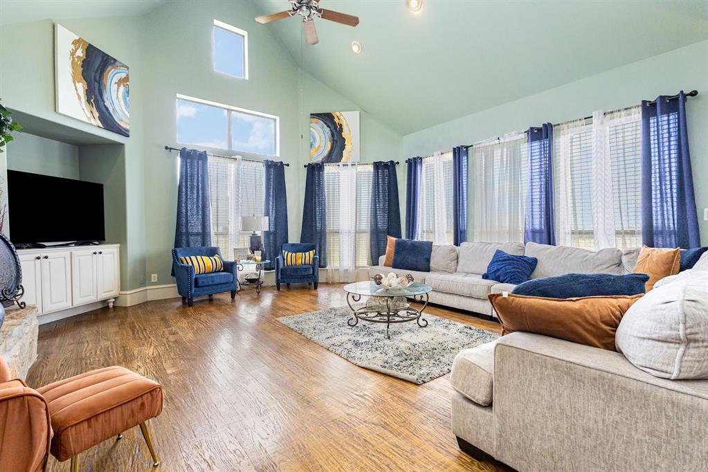 123 Ranch House Road Rockwall, TX 75032 - Photo 10 of 23 a living room with furniture and a flat screen tv