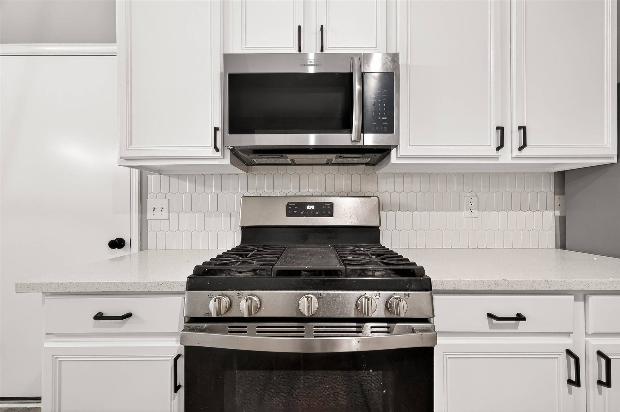 23810 Spring Way Drive Spring, TX 77373 - Photo 7 of 35 a stove top oven sitting inside of a kitchen