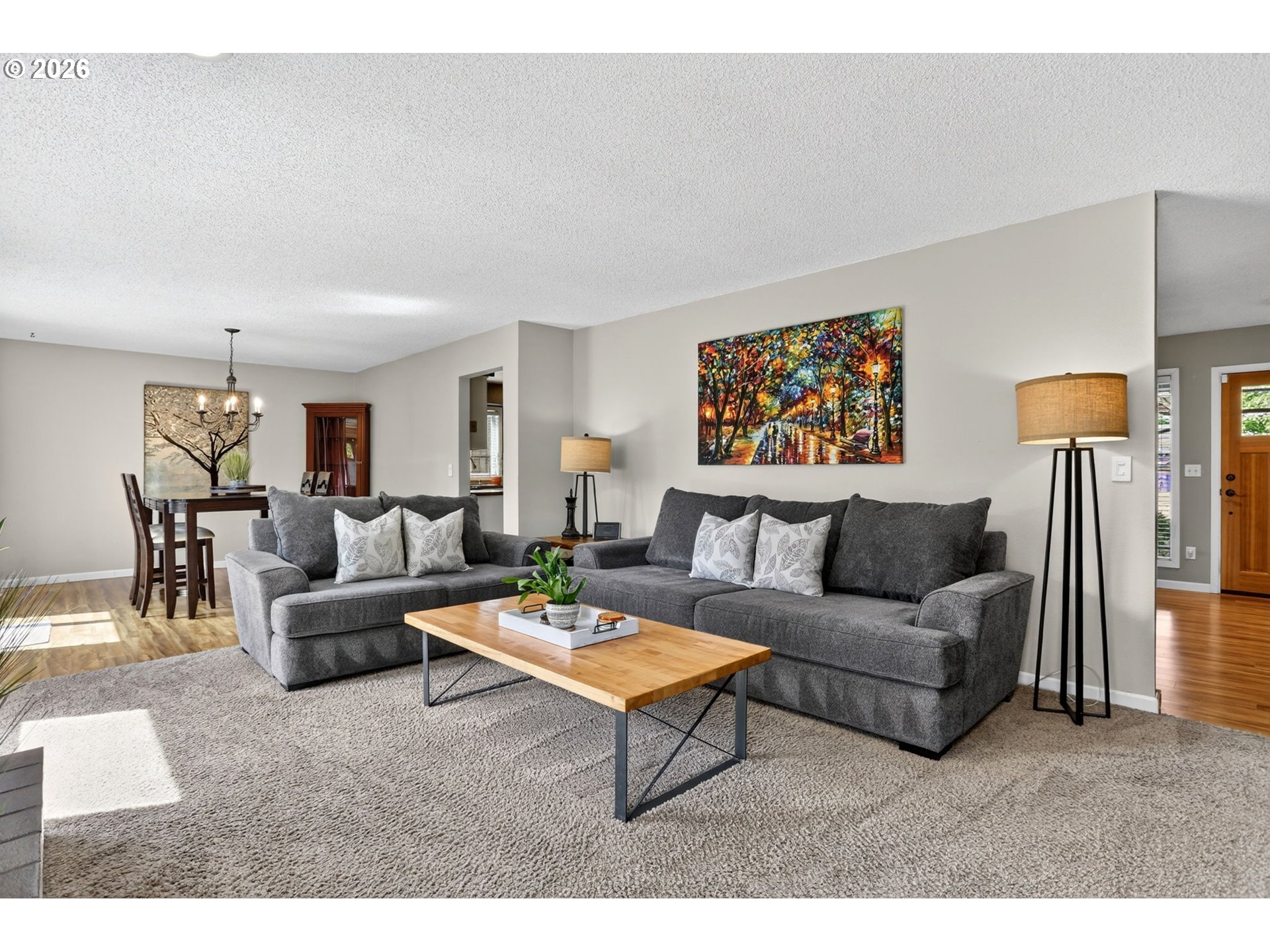 1776 Southeast 114th Place Portland, OR 97216 - Photo 24 of 47 a living room with furniture a rug and a wall painting