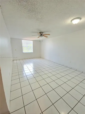 a view of a livingroom and window
